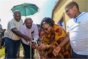 Minister Pemmy Majodina opening a tap at one of houses in uMshwathi in KZN Province